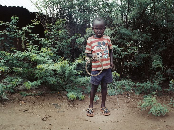 Mark Neville, ‘Boy with Hoop in Kakuma Refugee Camp, Kenya’, 2016, courtesy Mark Neville