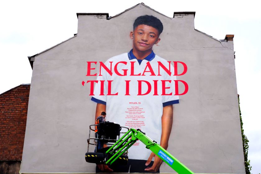 Larger-than-life murals honour young football fans lost to heart disease