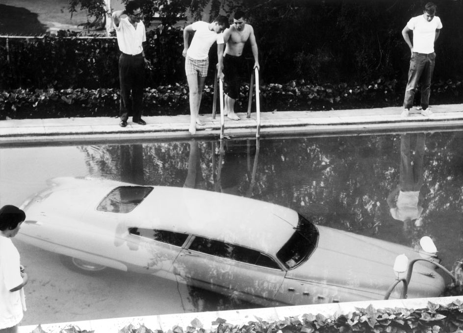 4th May 1961: A submerged car which its drunken owner 'parked' in a swimming pool in Beverly Hills, California, believing it to be a parking space. Nobody was injured in the process. (Photo by Keystone/Getty Images)