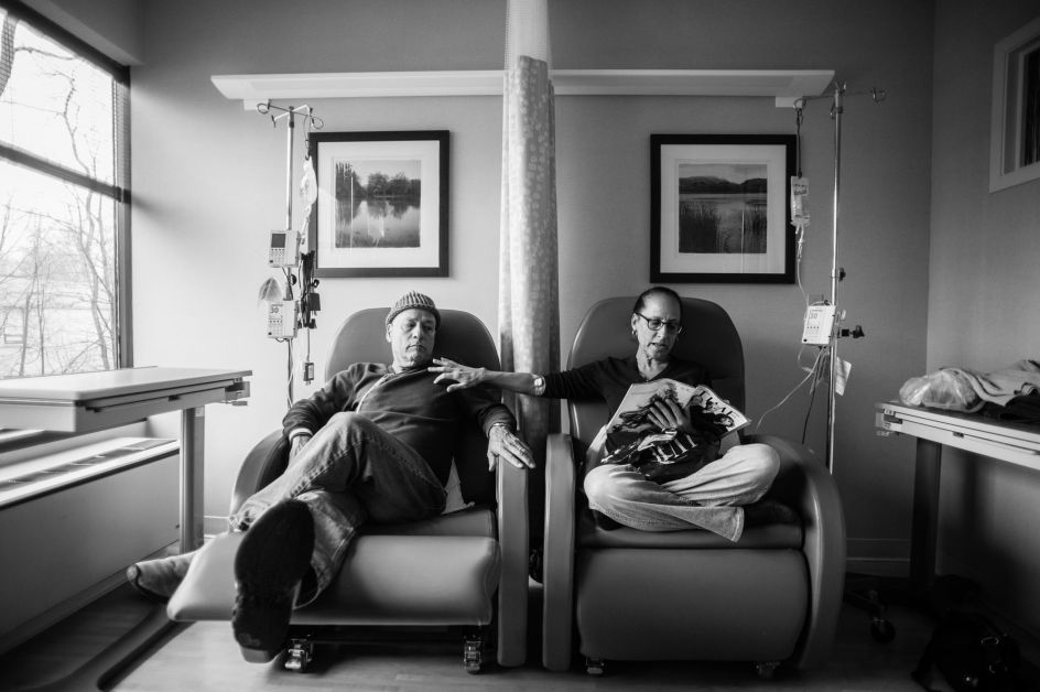 Long-Term Projects, second prize stories: Howie sits beside his wife Laurel in what he calls their “his and hers” chairs as they get their weekly chemotherapy treatments. Nancy Borowick.