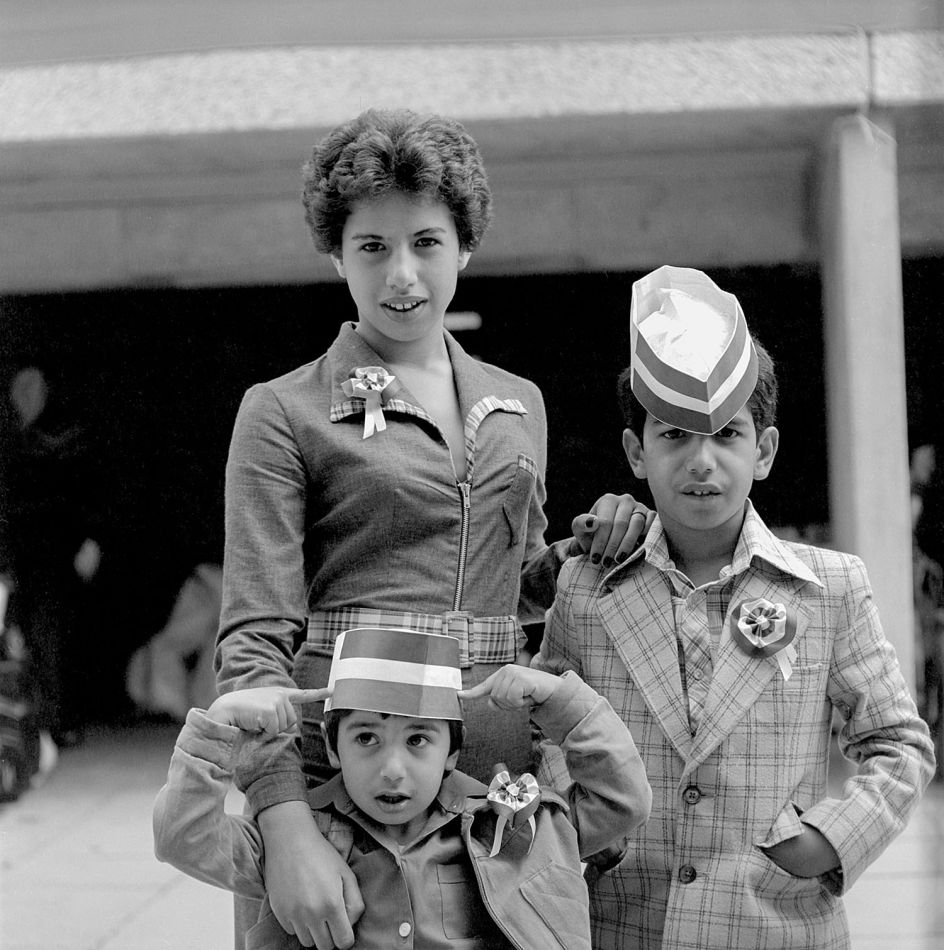Sheniz Bayraktar (née Mehmet) with her brothers at a celebration of The Queen’s Silver Jubilee in South Thamesmead. 1977 Photography © George Plemper