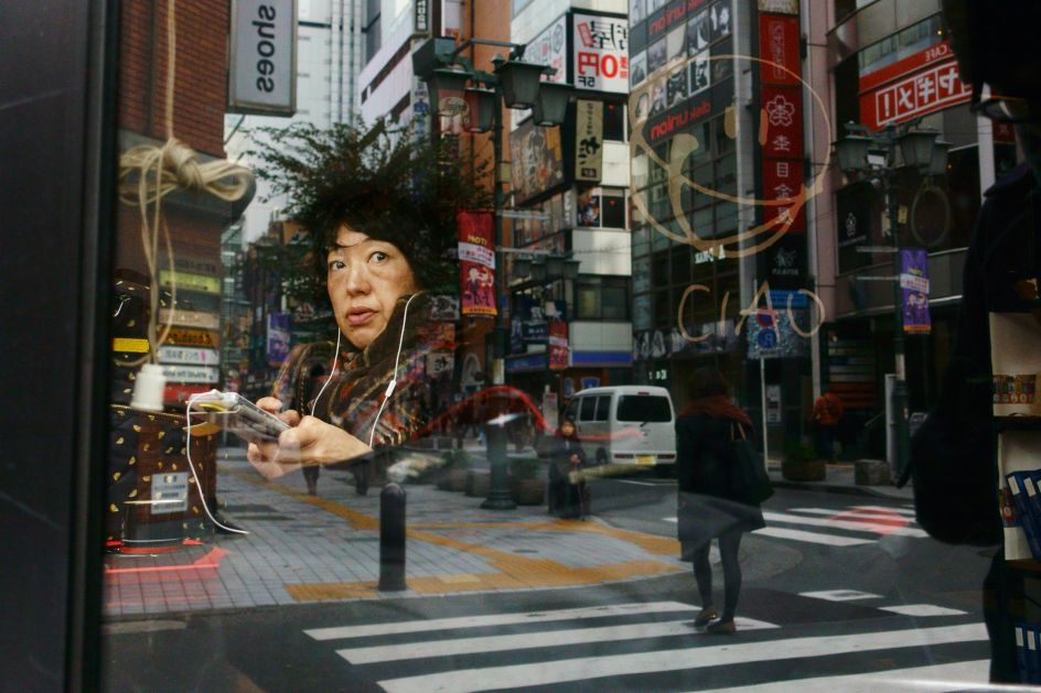 The reflection of the tree on the woman hair in the mid town | © Tavepong Pratoomwong, Thailand, Shortlist, Open, Street Photography, 2017 Sony World Photography Awards