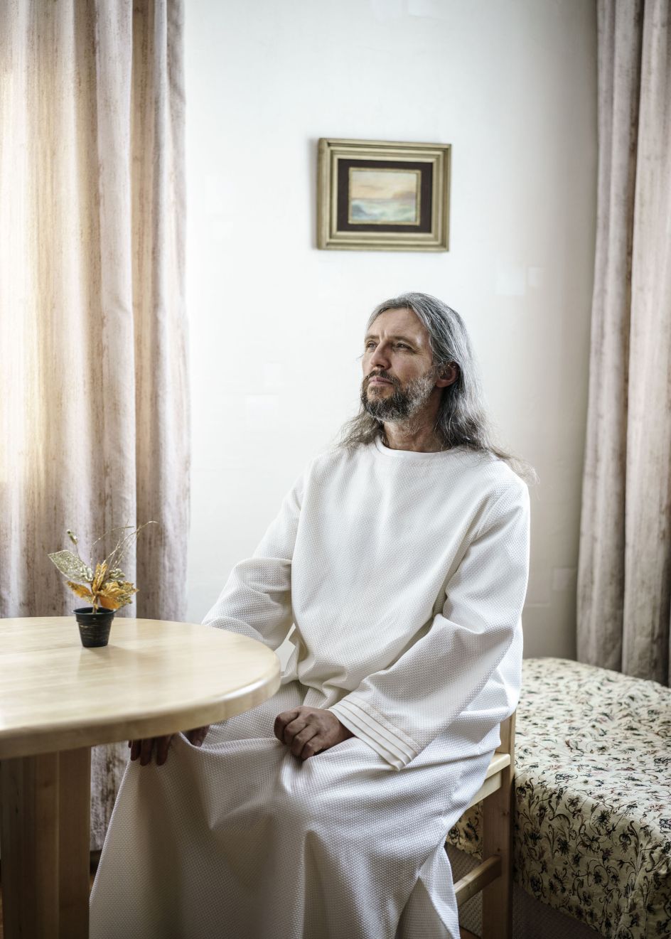 Vissarion, the Christ of Siberia. Formerly a traffic policeman in the 1980s, he got his first revelation that he was Jesus Christ at the same time as the breakup of the Soviet Union. Since then he has gathered a following of 5-10 000 disciples in the Siberian forest. There they live in separate villages with their own infrastructure and social systems. Russia, 2016 | © Jonas Bendiksen/ Magnum Photos