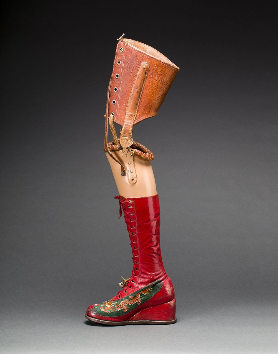 Prosthetic leg with leather boot. Appliquéd silk with embroidered Chinese motifs. Photograph Javier Hinojosa. Museo Frida Kahlo. © Diego Riviera and Frida Kahlo Archives, Banco de México, Fiduciary of the Trust of the Diego Riviera and Frida Kahlo Museums
