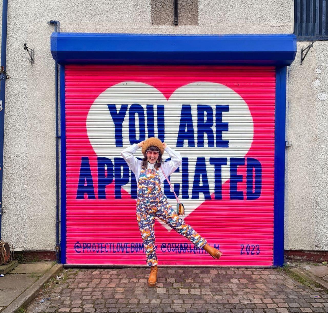 Mural by Oskar with a K; photo featuring Caitlin Hare