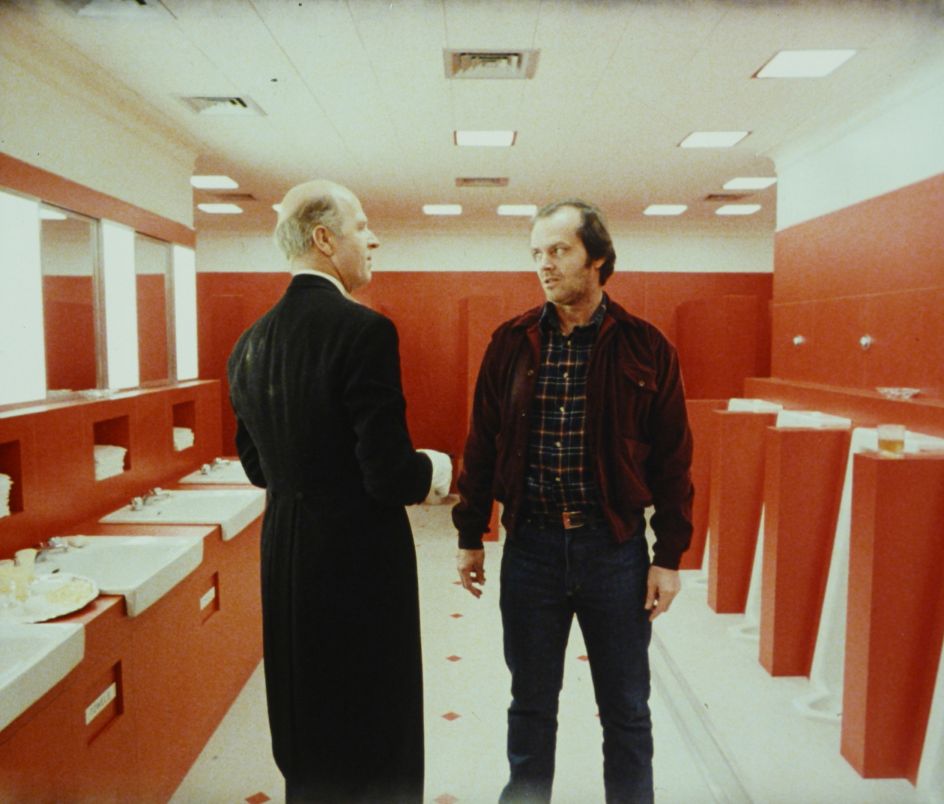 The Shining, directed by Stanley Kubrick (1980; GB/United States). Grady (Philip Stone) and Jack Torrance (Jack Nicholson). Still image. © Warner Bros. Entertainment Inc.