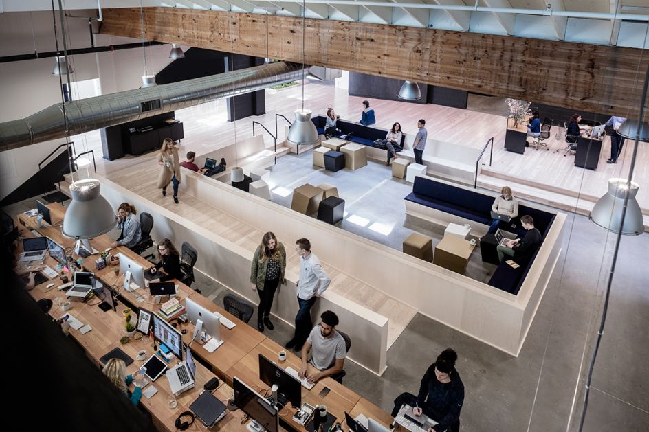 Swift Colony: Seen from the mezzanine, the Colony is a space to gather for  staff-wide meetings, events and conversation.