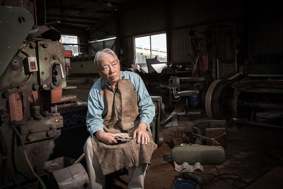 Katsuyuki Yashima sitting in his own workshop, which employed 15 people before the disaster