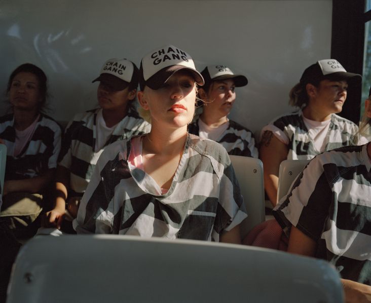 Female inmates on the bus at dawn