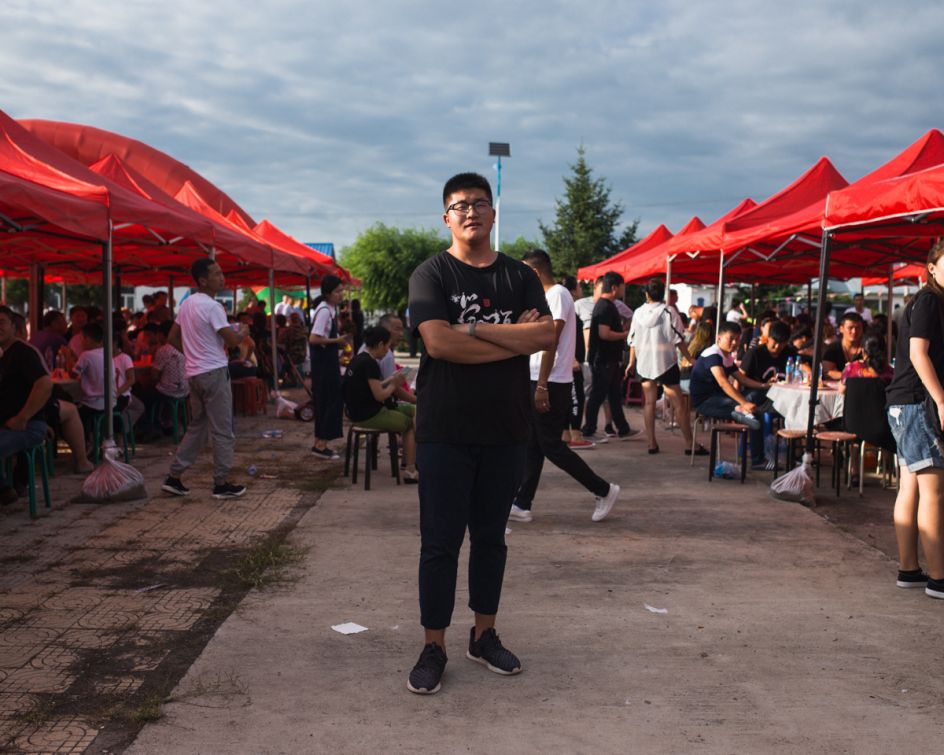 Heilongjiang River, August 2017 Young Oroqen depart after lunch on a restaurant on the river. The Heilongjiang (or Amur in Russian) acts as the border between China and Siberia and historically Oroqen and many other ethnic groups moved between the two regions.
