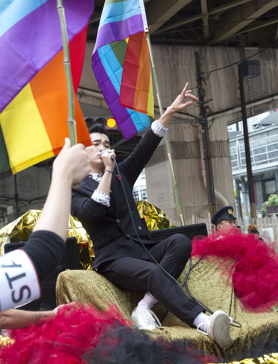Shingo from Apotheke singing from the lead float at the Kansai Rainbow Parade, Copyright © 2017  by Michel Delsol, originally  appeared in Edges of the Rainbow: LGBTQ Japan, published by The New Press.