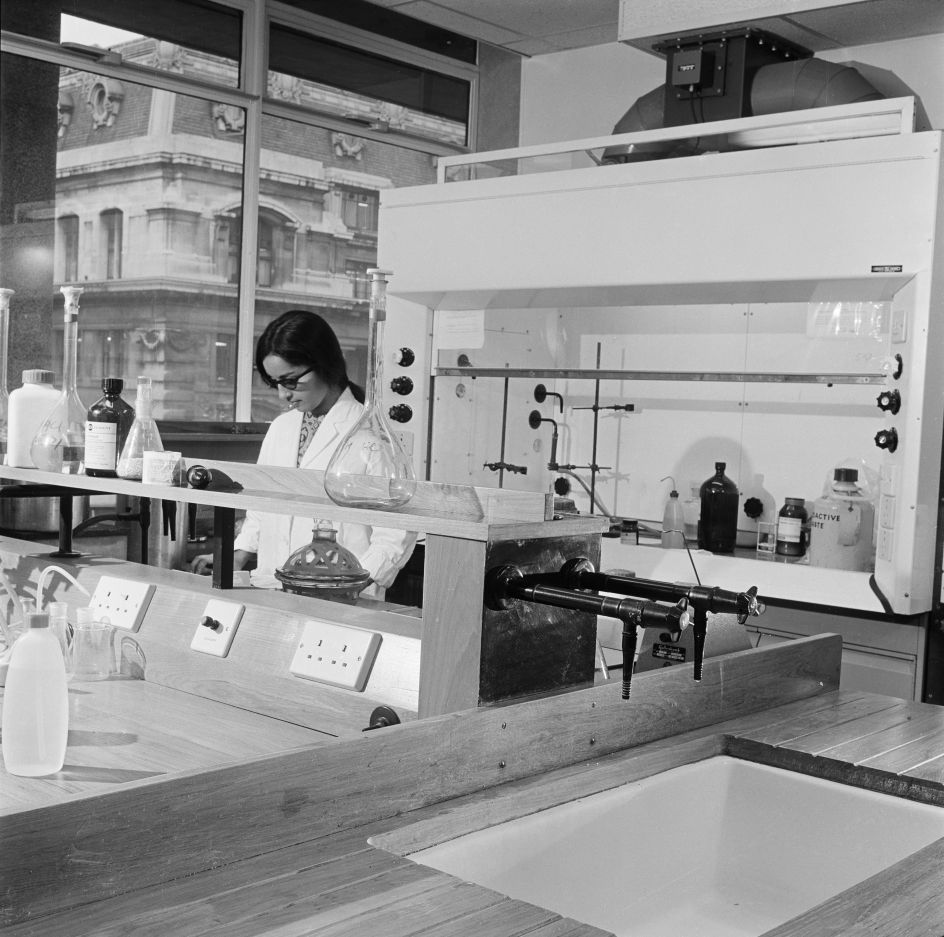 Woman working in chemistry lab, King’s College, University of London, Copyright Historic England