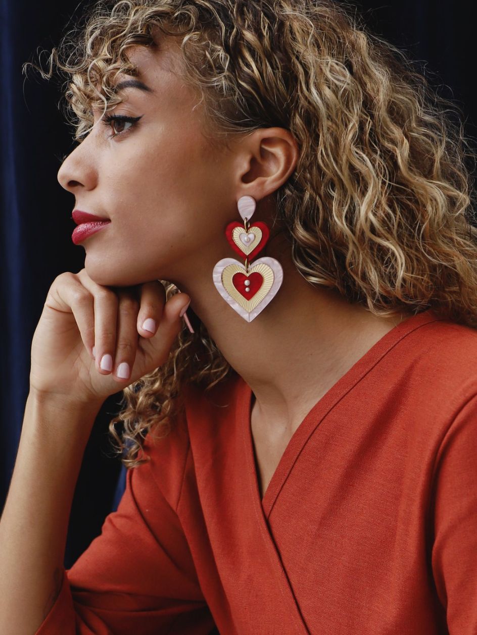Ava statement earrings by [Wolf & Moon](https://www.wolfandmoon.com/collections/reverie/products/ava-statement-earrings-in-red-pink-limited-edition). Priced at £85