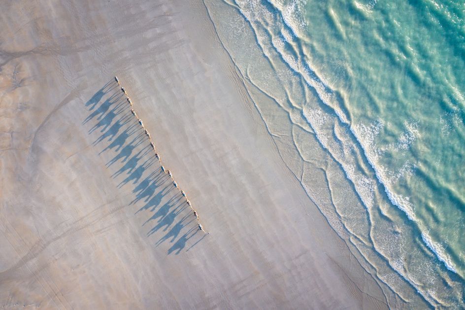 Enjoying the sunset from the famous Cable Beach and watching the camels walking by.  Shot taken with DJI Mavic Pro.  Copyright: © Jonas Börnicke, Germany, Shortlist, Open, Travel (Open competition), 2018 Sony World Photography Awards