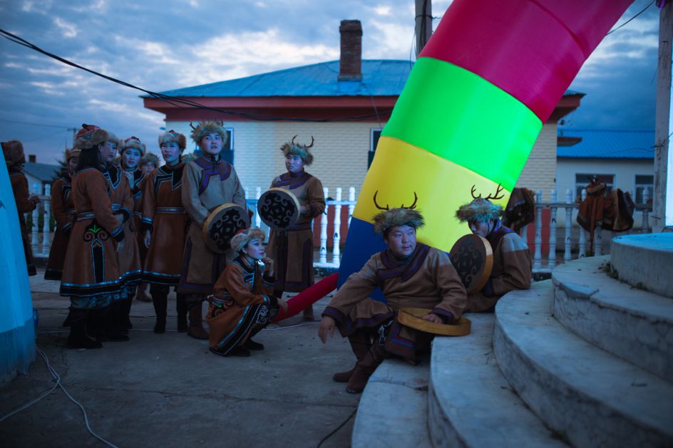Xin'e Oroqen Settlement, August 2017 Performers plucked from the local youth wait to perform at the annual Fire Festival. Whilst Xin'e is designated an Oroqen settlement, the ethnic diversity of the region is reflected in the backgrounds of the performers, many of whom are Oroqen, Ewenki or Mongolian or have one parent from the Han majority population following increasing levels of intermarriage throughout the 20th and 21st centuries.