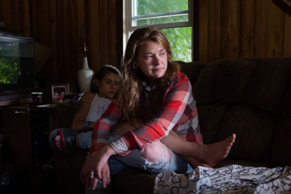 Allie crying, facing jail time and missing Barbie who died of an overdose, after a long night of using. © Mark E. Trent