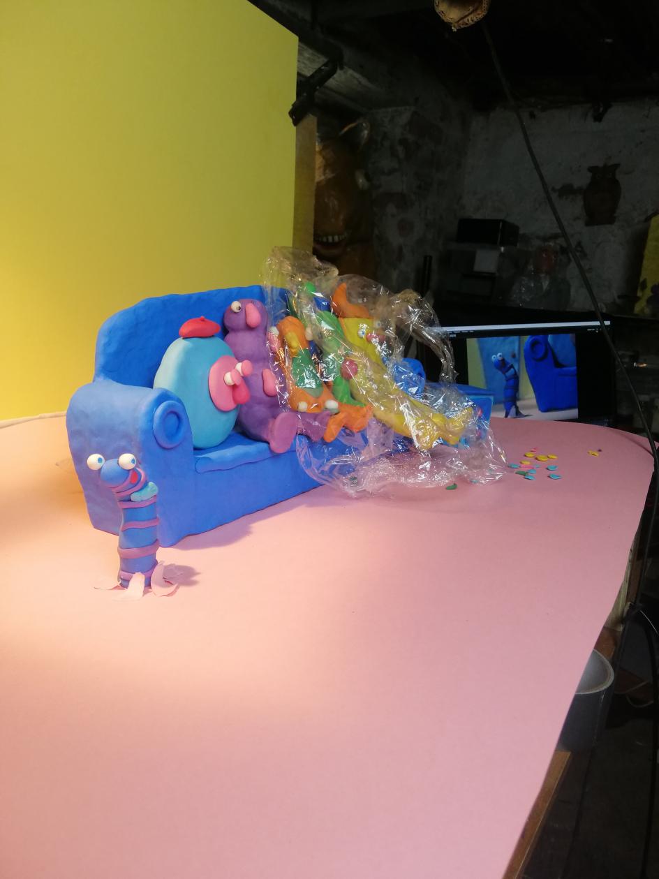 The cellophane helps keep the plasticine from getting mucky