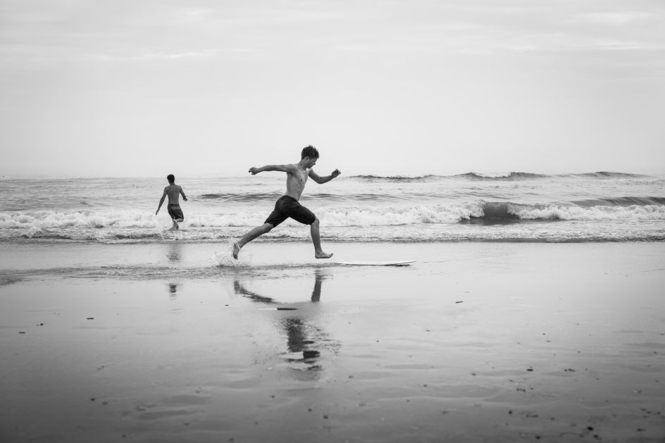 Zane Rockwell of suburban Philadelphia skimboards in the shallow surf. June 2018. © Timothy Roberts