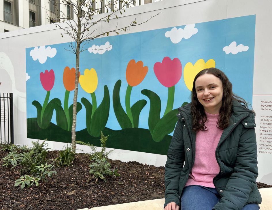 Chloe with her mural at Coppermaker Square in Stratford, London.