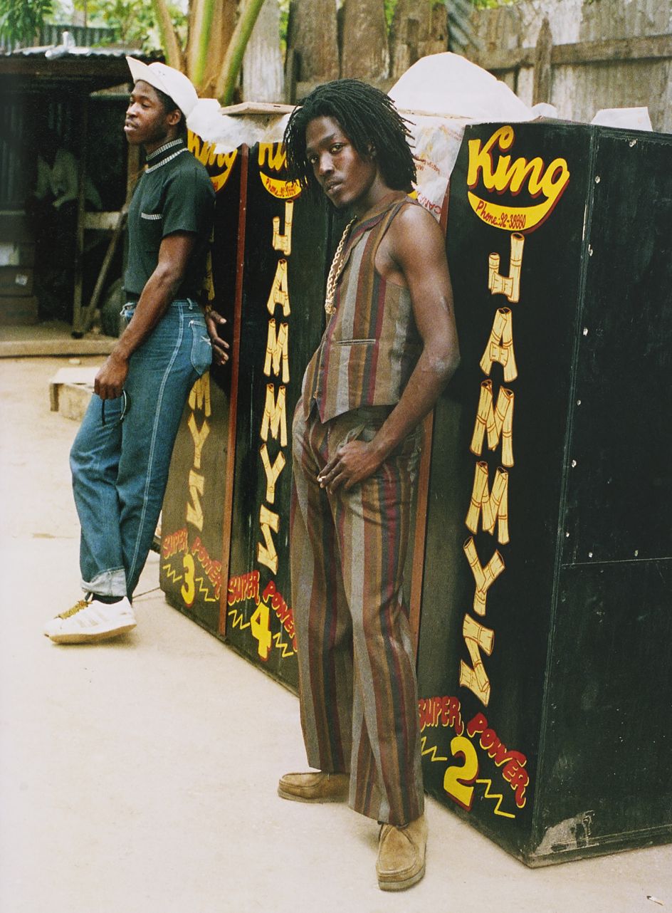 Singer Junior Reid wearing Wallabees and pants length with matching waiscoat, King Jammy's yard, Kingston 1986. Photgraph © Beth Lesser