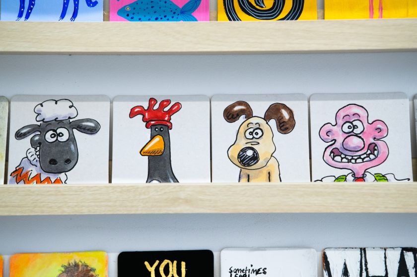 Big-name artists and celebrities illustrate beermats to fight testicular cancer