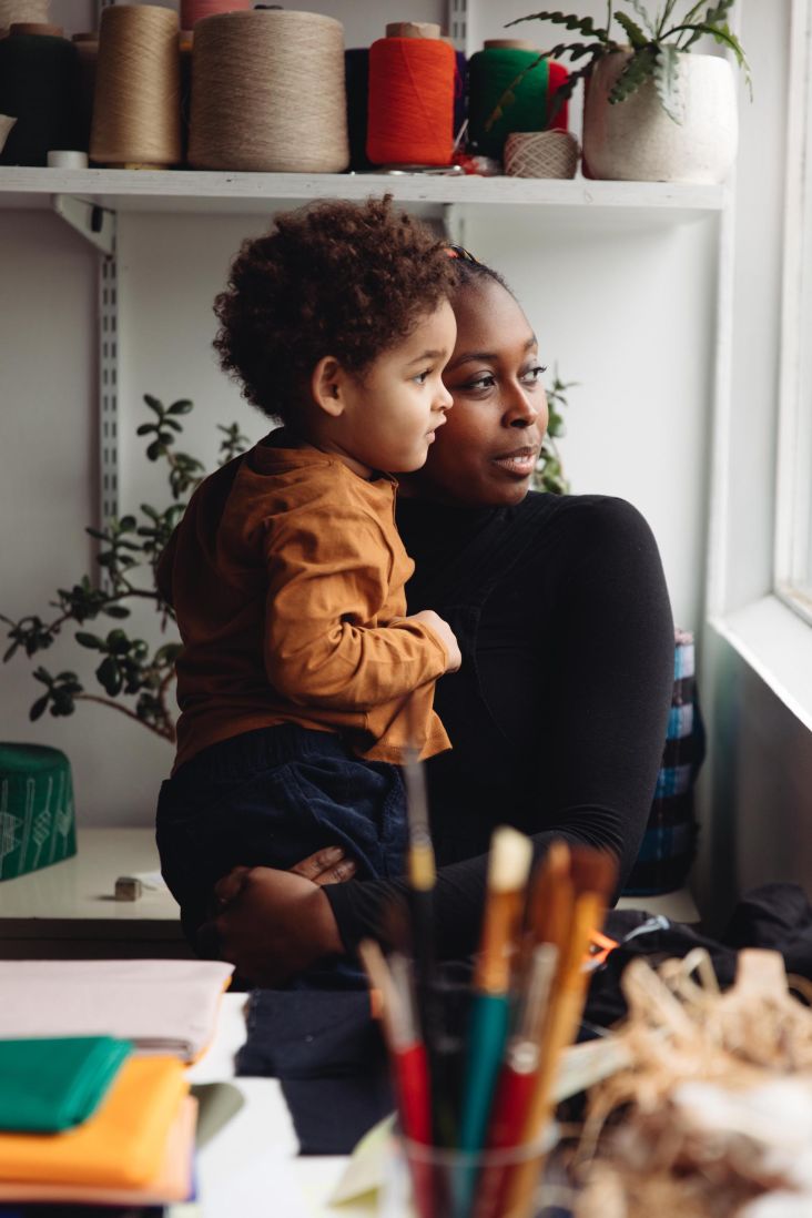 Textile designer Yemi Awosile with her son Ezra shot at her East London studio