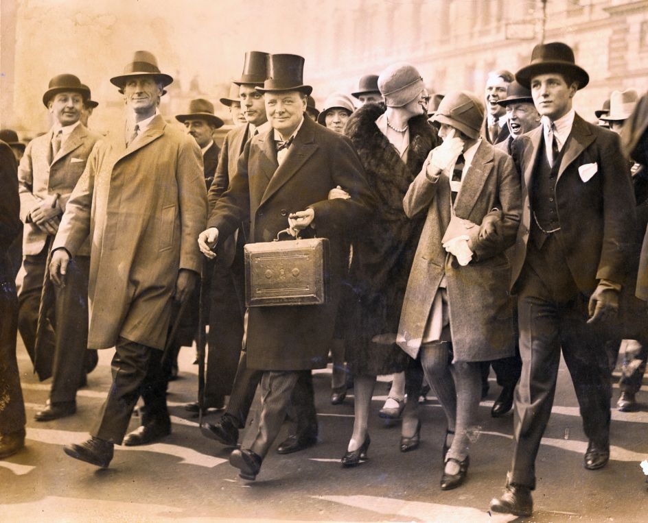 Winston Churchill, Chancellor of the Exchequer, carries the despatch box on his way to the House of Commons, in London, to present the budget, April 29, 1929. Photo Credit Bettman/Getty