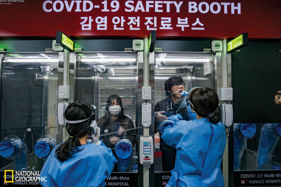 At the H Plus Yangji Hospital in Seoul, a walk-in testing clinic is set up like a row of phone booths to prevent contact between patients and medical staff. Nose and mouth swabs take less than three minutes, and test results can be returned in four to six hours. Experience with previous disease outbreaks prepared South Korea for the COVID-19 pandemic. The country already had a legal framework for contact tracing, and most residents stayed home and wore masks in public. The government worked with the private sector to swiftly ramp up testing. There are hundreds of testing sites throughout the country. (Jun Michael Park/National Geographic)
