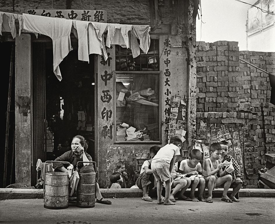 Fan Ho 'Work and Play(成人工作・小孩玩樂)' Hong Kong 1950s and 60s, courtesy of Blue Lotus Gallery