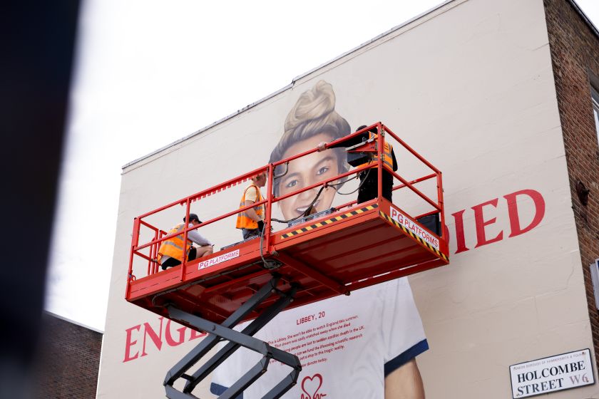 Larger-than-life murals honour young football fans lost to heart disease