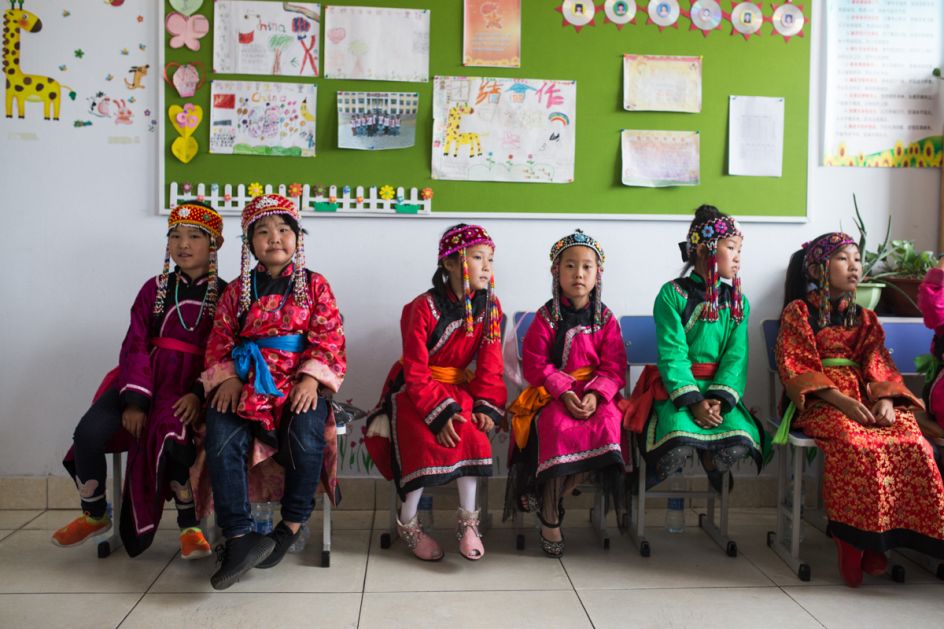 Oroqen School, Heilongjiang Province, July 2017 At Oroqen schools, the curriculum attempts to counter a dwindling of the ethnic minority's language, working lessons in Oroqen into their students' weekly schedule. Online platforms are being developed to engage younger learners, however the language remains under threat of extinction. Oroqen children are a minority at the school, with only two of the children pictured having Oroqen lineage.