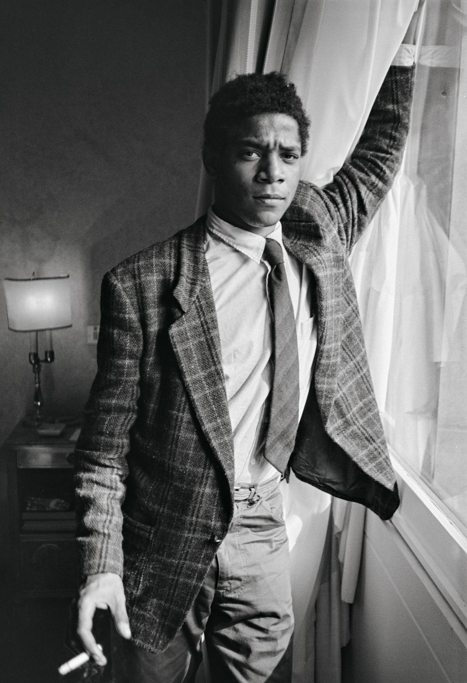 Jean Michel in a Milan hotel room, October 8, 1983. Copyright: © The Andy Warhol Foundation for the Visual Arts, Inc.