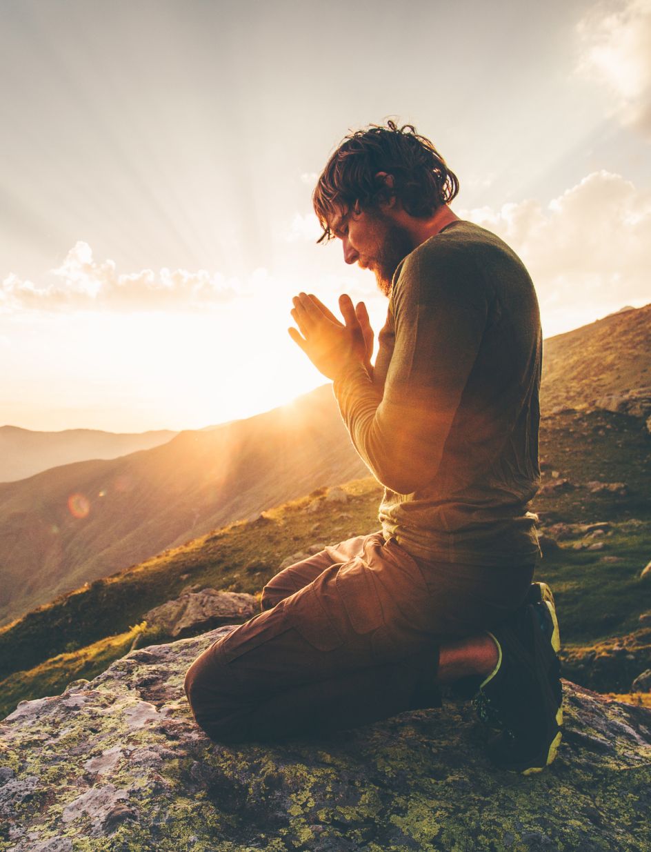ID: [154274438](https://stock.adobe.com/images/man-praying-at-sunset-mountains-travel-lifestyle-spiritual-relaxation-emotional-concept-vacations-outdoor-harmony-with-nature-landscape/154274438?prev_url=detail)