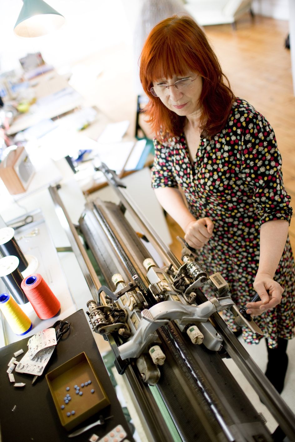 Susie Freeman with her knitting machine. Photography by Tom Lee