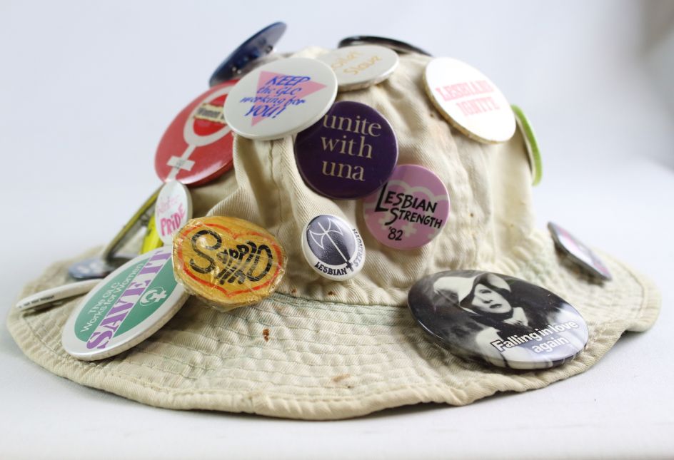 Bucket hat with badges, 1970s to 2000s, From the collections  of Glasgow Women’s Library
