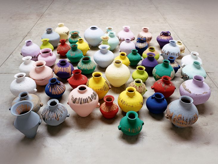 Ai Weiwei, Coloured Vases, 2006, 51 Neolithic vases, (5,000–3,000 BCE), industrial paint, variable dimensons. Picture credit: Courtesy of Ai Weiwei Studio