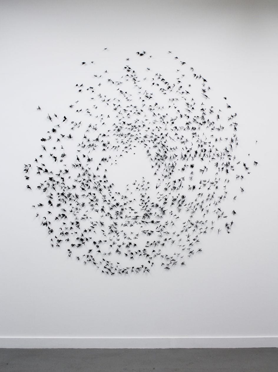 Frances Gallardo ( Puerto Rican , b. 1984 ) Murmuration (Mosquito cloud) , 20 17 Installation of laser cut paper pinned on wall Courtesy of the artist © Frances Gallardo
