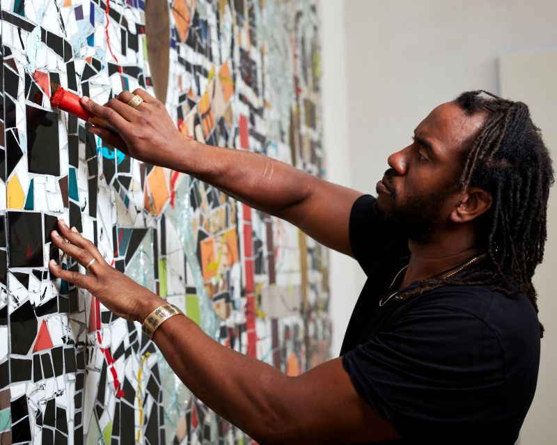 Rashid Johnson mixes painting and ceramic tile mosaics to express