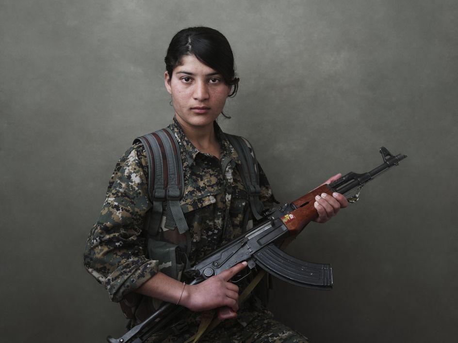 Portrait of Evrim Şengal, a volunteer fighter of the YJÊ. Shengal Mountain, Nineveh Governorate, Iraq, March 12, 2015. From [We Came From Fire​](​https://amzn.to/2L9l8Vm) by Joey L. – published by powerHouse Books