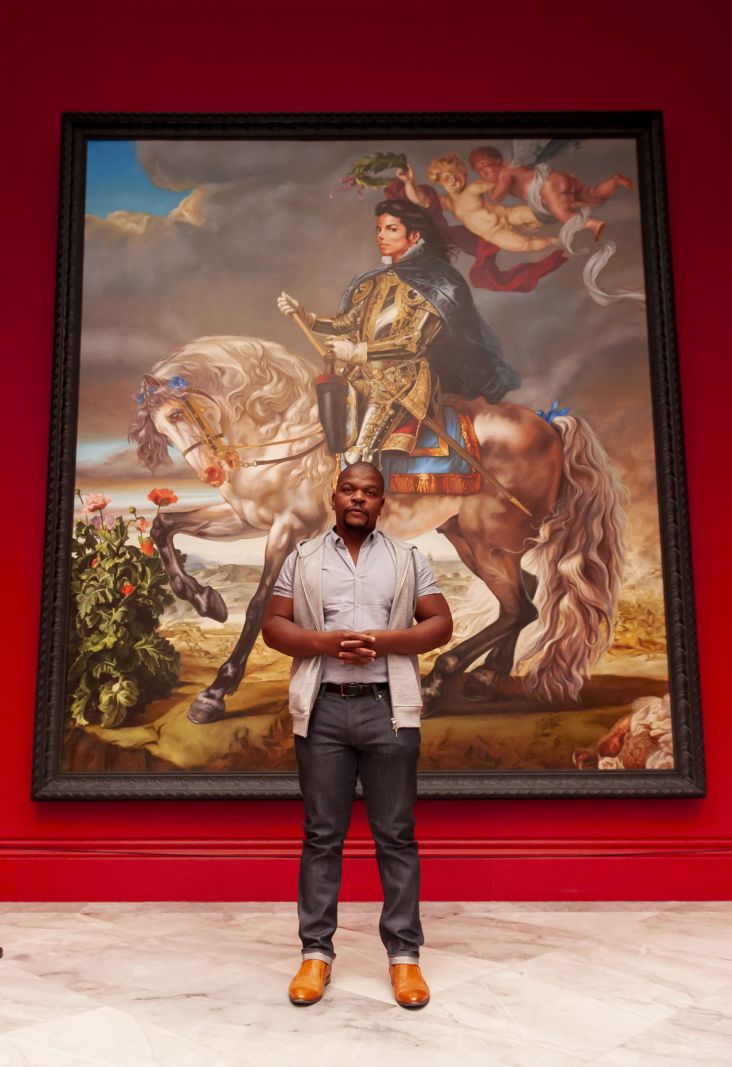 Kehinde Wiley in front of his painting, Equestrian Portrait of King Philip II, 2009. Photograph by Jorge Herrera