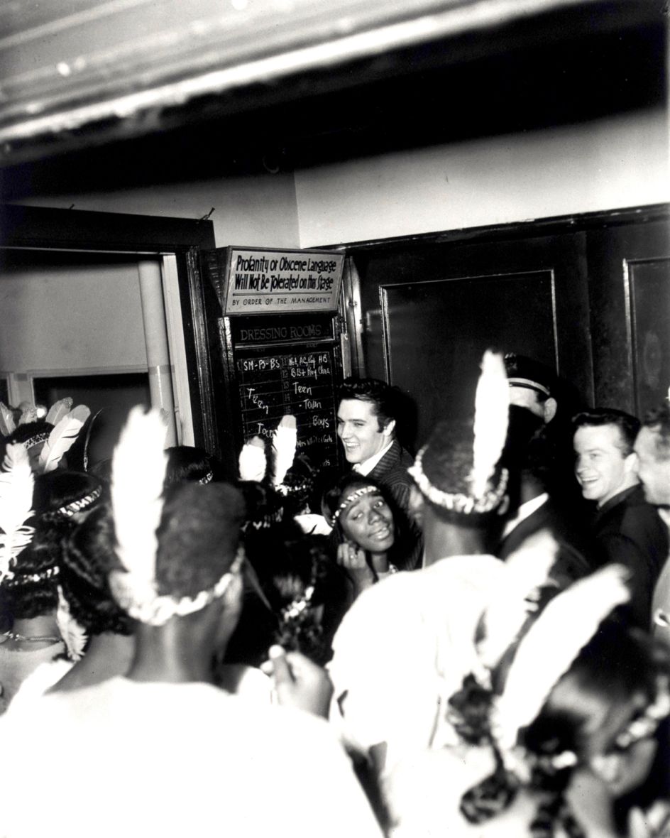 Elvis backstage, WDIA Goodwill Revue, Ellis Auditorium, December 7, 1956 (CarlaThomas in front) © Estate of Ernest C Withers. Courtesy of Michael Hoppen Gallery