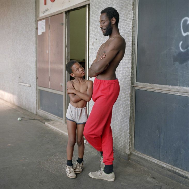 Bill Stephenson, 'Tony the Ton' and Martin age 8, outside the Pop In Centre. Hyde Park Flats, Sheffield, 1988  © Bill Stephenson