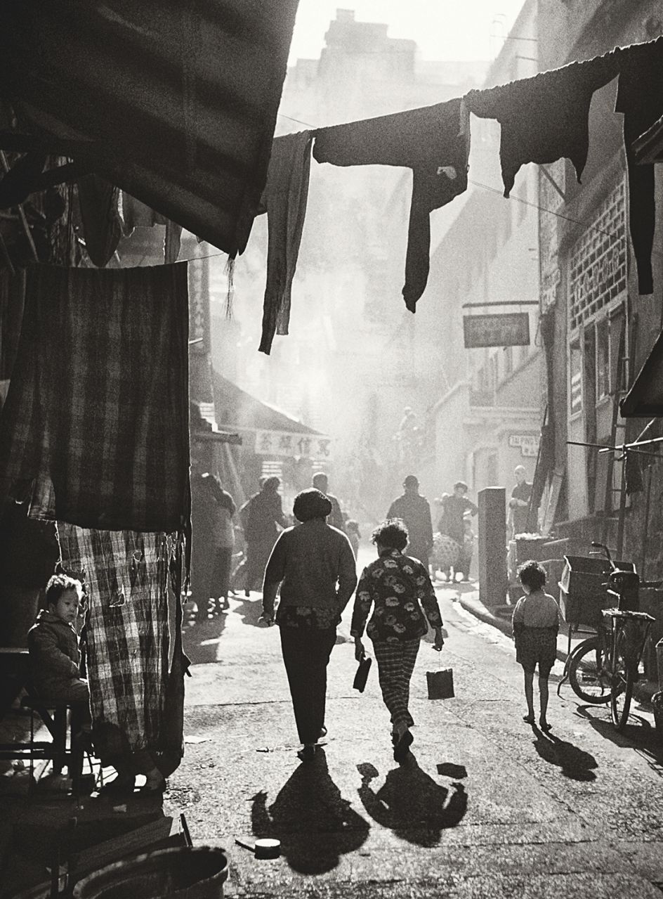 Fan Ho 'Strolling to Tai Ping Shan Street(漫步太平山街)' Hong Kong 1950s and 60s, courtesy of Blue Lotus Gallery