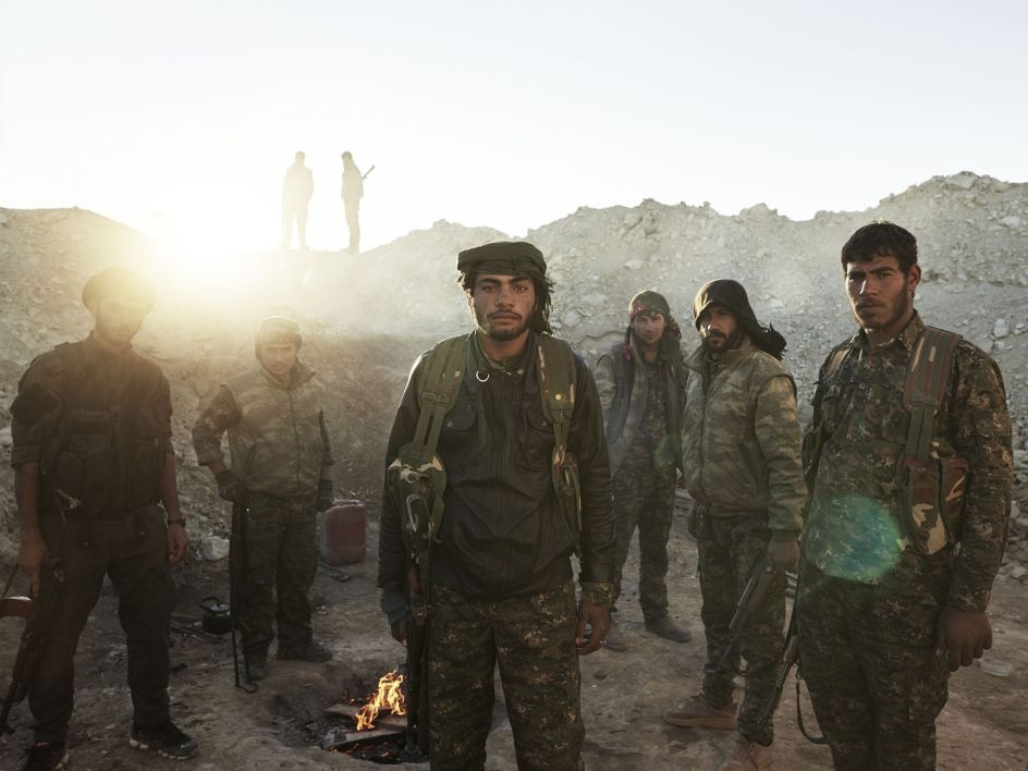Arab and Kurdish members of People’s Protection Units (YPG) in a frontline position. al-Hawl, Jazira Canton, Rojava, Syria, December 4, 2015. From [We Came From Fire​](​https://amzn.to/2L9l8Vm) by Joey L. – published by powerHouse Books
