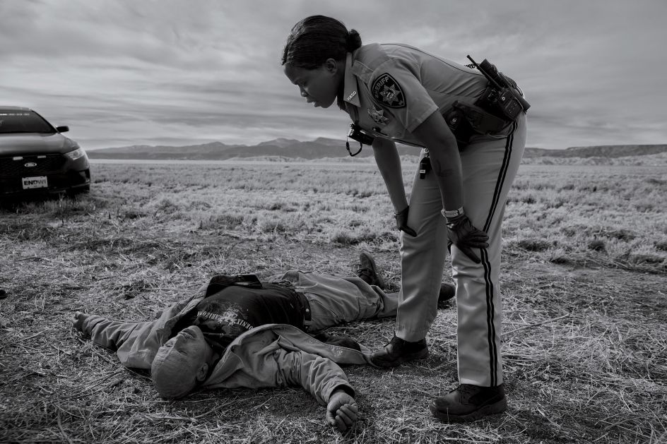 Dorothy Onikute, 33, a deputy sheriff with the Rio Arriba County sheriff’s office, responding to an overdose call on Feb. 4, on the side of the road in Alcalde, N.M. Photograph by James Nachtwey for TIME