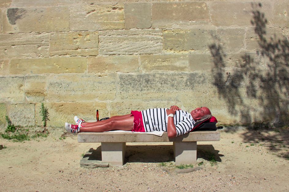 Les Bronzeurs - Alexandre Pruvost:  In Paris, when the sun is back, the 'bronzeur' goes along the Seine. Wearing clothes or almost naked, he is looking for the perfect spot to enjoy the sun. (Professional Candid)