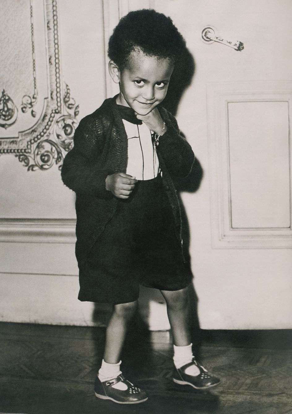 Two-year-old Prince Paul Wossen-Seged Makonnen, grandson of Ethiopian Emperor Haile Selassie, wearing Playe-Up sandals, London, November 1949. Photgrapher unknown. Courtesy AGTA/CJC