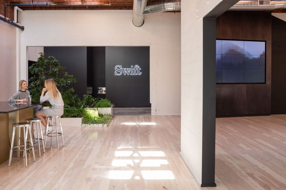 Swift Kitchen Sign: Sunlight and slab marble shine in the central kitchen,  a popular gathering spot throughout the day.