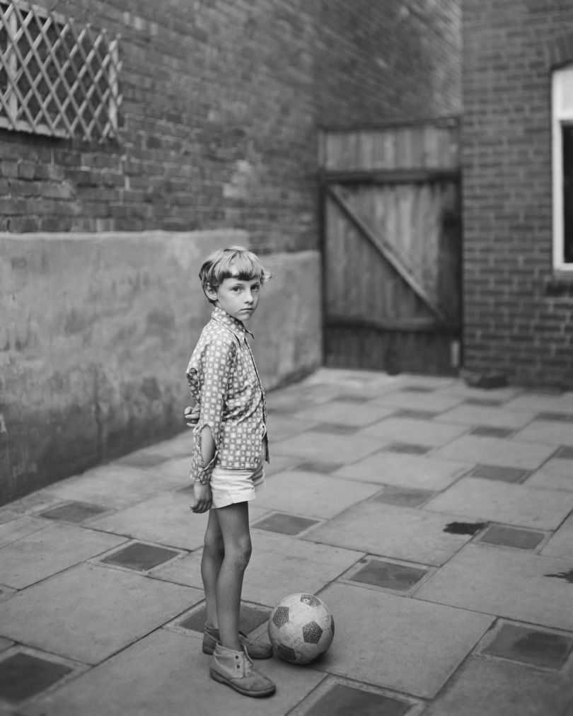 Young boy with ball, 1974 © John Myers courtesy RRB PhotoBooks