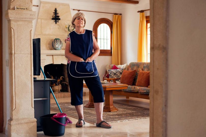 Linda works cleaning holiday villas to pay her bills and rent. She likes being able to have an outdoor life 8-9 months of the year but misses being able to watch her grandchildren grow up in England.